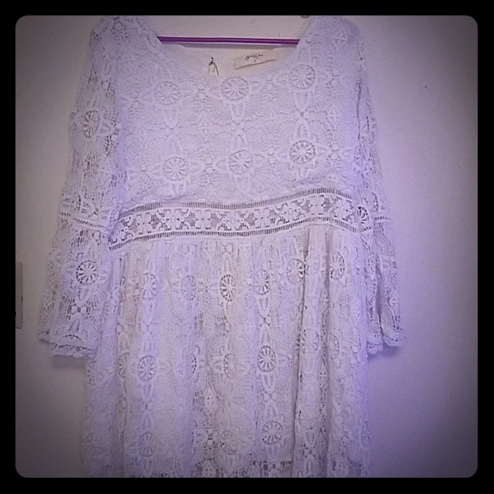 white long sleeve dress with cut out on the waist